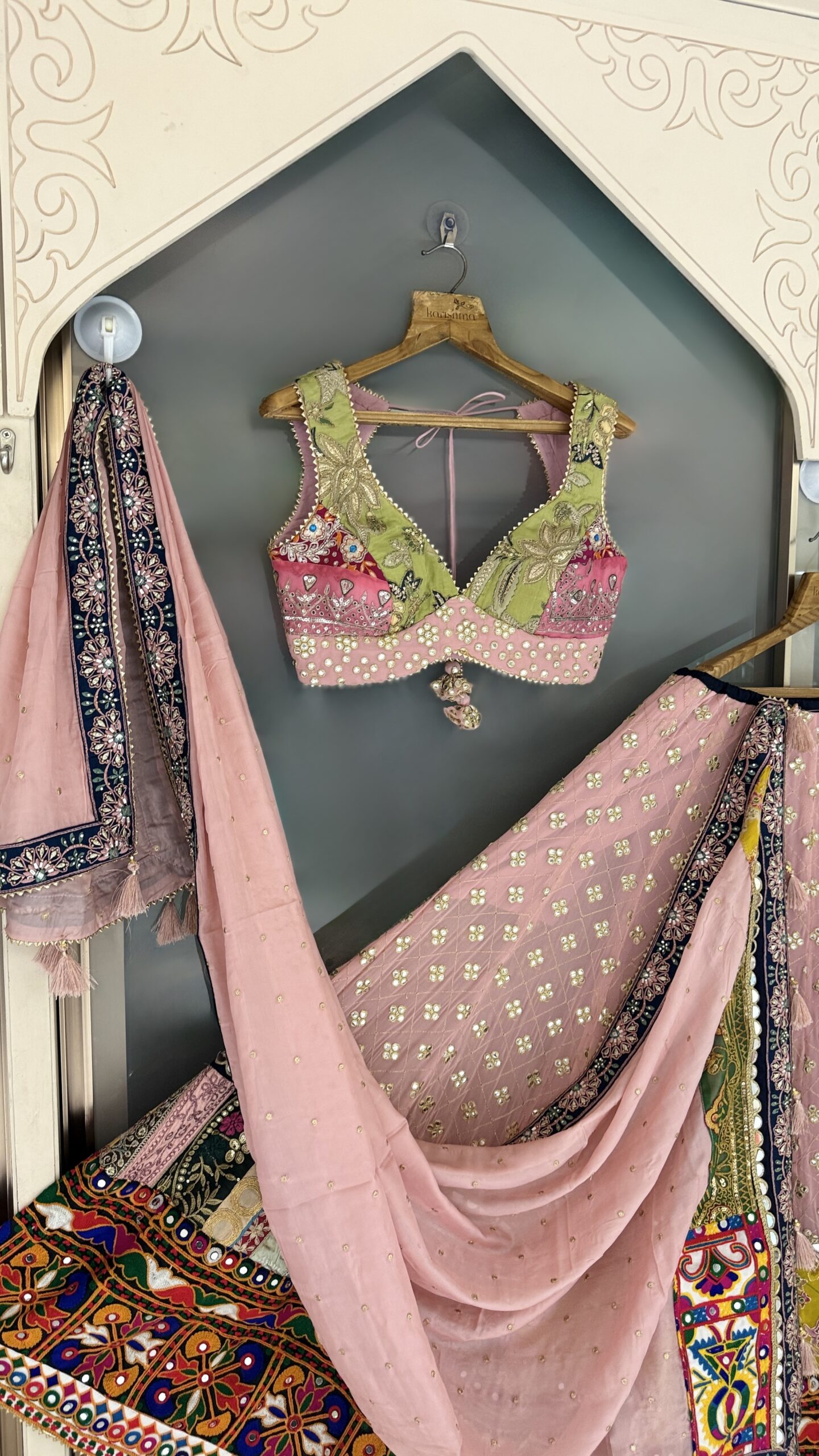 Mirror work blush pink and sage green embroidered blouse close-up